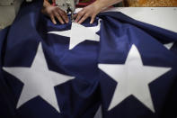 <p>A worker sews a star on to an American flag at the FlagSource facility in Batavia, Illinois, U.S., on Tuesday, June 27, 2017. (Photo: Jim Young/Bloomberg via Getty Images) </p>