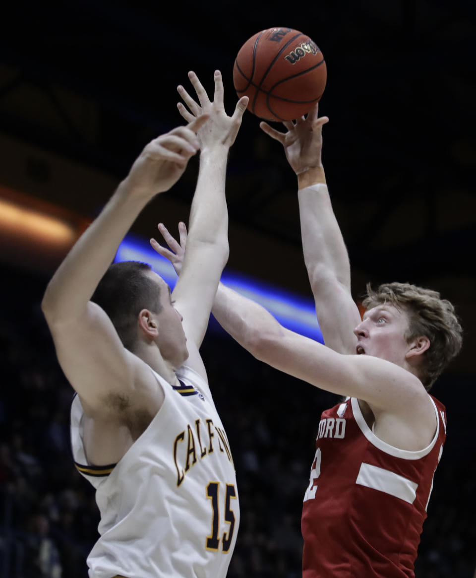 Stanford's James Keefe, right, shoots against California's Grant Anticevich (15) in the first half of an NCAA college basketball game Sunday, Jan. 26, 2020, in Berkeley, Calif. (AP Photo/Ben Margot)