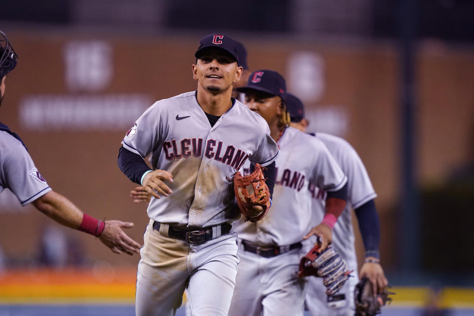 Cleveland Guardians second baseman Andres Gimenez is greeted by catcher Austin Hedges after the ninth inning of a baseball game against the Detroit Tigers, Wednesday, Aug. 10, 2022, in Detroit. (AP Photo/Carlos Osorio)