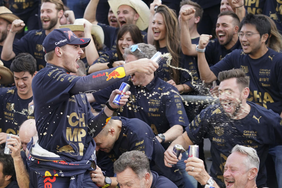 Red Bull driver Max Verstappen, of the Netherlands, celebrates with the Red Bull team following the Formula One U.S. Grand Prix auto race at Circuit of the Americas, Sunday, Oct. 23, 2022, in Austin, Texas. Verstappen won the race and team Red Bull won the constructors' championship. (AP Photo/Darron Cummings)