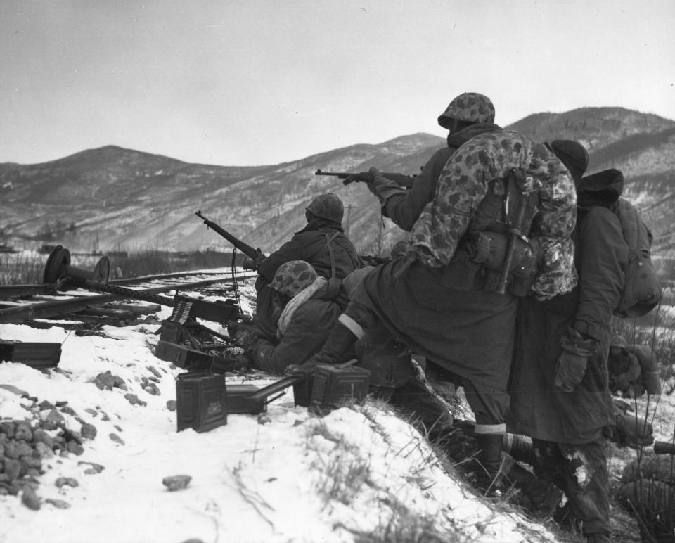 View of US Marines in winter gear as they fight entrenched Chinese troops during the Battle of Chosin Reservoir, Korea, December 7, 1950. (Photo by PhotoQuest/Getty Images)