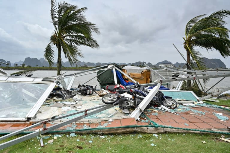 Rooftops of buildings were blown off and motorbikes were left toppled over in piles of rubble and glass (Nhac NGUYEN)