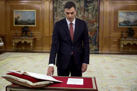 Spain's new Prime Minister and Socialist party (PSOE) leader Pedro Sanchez swears in during a ceremony at the Zarzuela Palace in Madrid, Spain, June 2, 2018. Emilio Naranjo/Pool via REUTERS