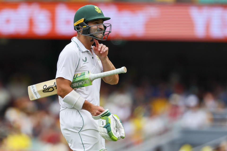 South Africa's Dean Elgar reacts as he walks from the field after he was dismissed by Australia's Pat Cummins during day two of the first cricket test between South Africa and Australia at the Gabba in Brisbane, Australia, Sunday, Dec.18, 2022. (AP Photo/Tertius Pickard)