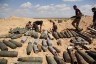 Libyan forces prepare to detonate and dispose of explosives and shells left behind by Islamic State militants in Sirte following a battle, at Misrata, Libya. REUTERS/Stringer