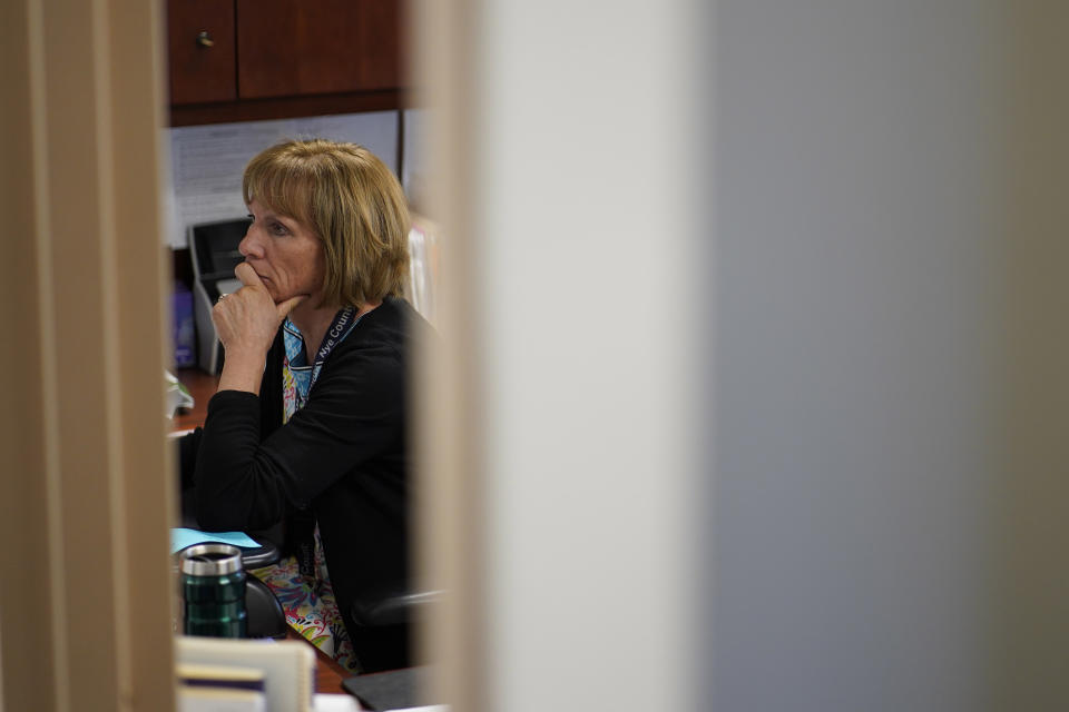 Nye County Clerk Sam Merlino works in her office, Monday, July 18, 2022, in Tonopah, Nev. Merlino is stepping down from the position, leaving the administration of elections in a county the size of New Hampshire to a new clerk. (AP Photo/John Locher)