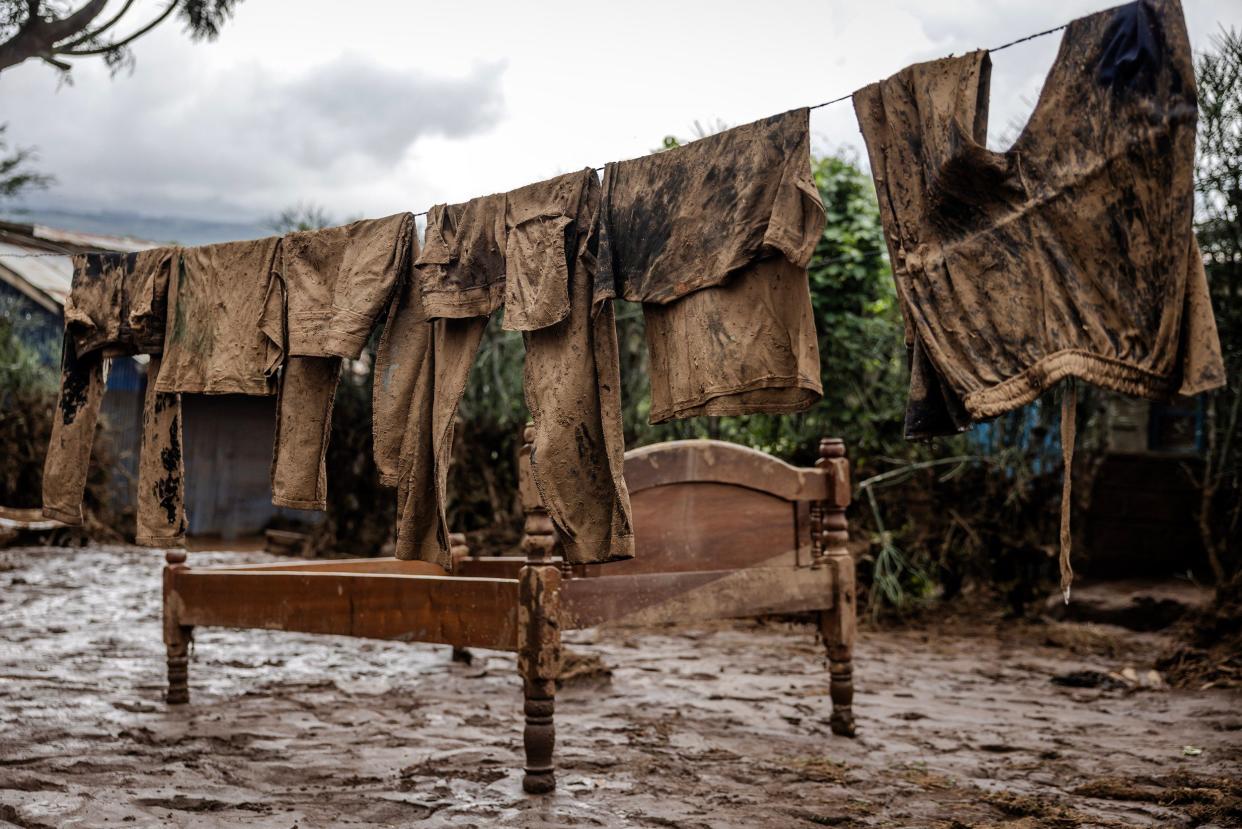 Clothes are seen covered in mud at a house that was flooded in an area heavily affected by torrential rains and flash floods in Mai Mahiu