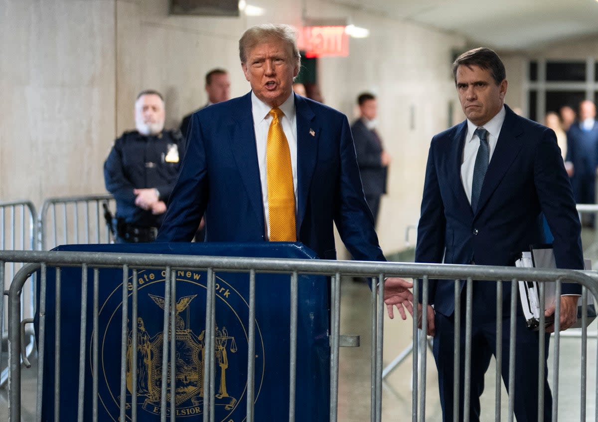 Donald Trump speaks to reporters in a Manhattan criminal courthouse on 2 May. (POOL/AFP via Getty Images)