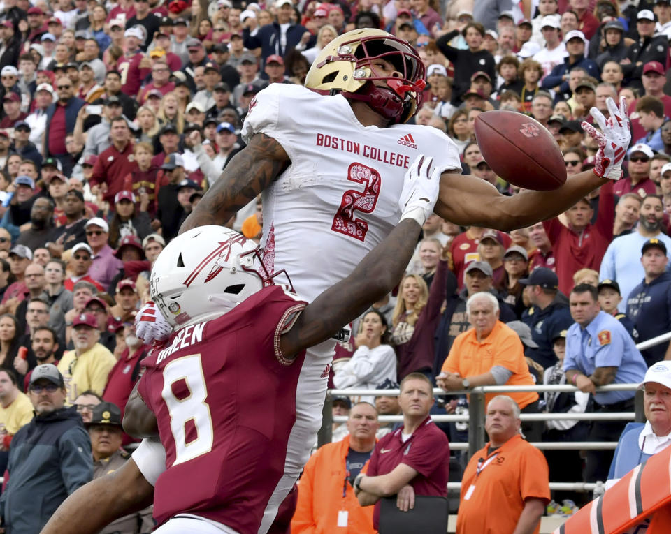 Boston College wide receiver Joseph Griffin Jr. (2) attempts to pull in a pass in the endzone but was thwarted by Florida State defensive back Renardo Green (8) during the second half of an NCAA college football game Saturday, Sept. 16, 2023 in Boston. (AP Photo/Mark Stockwell)