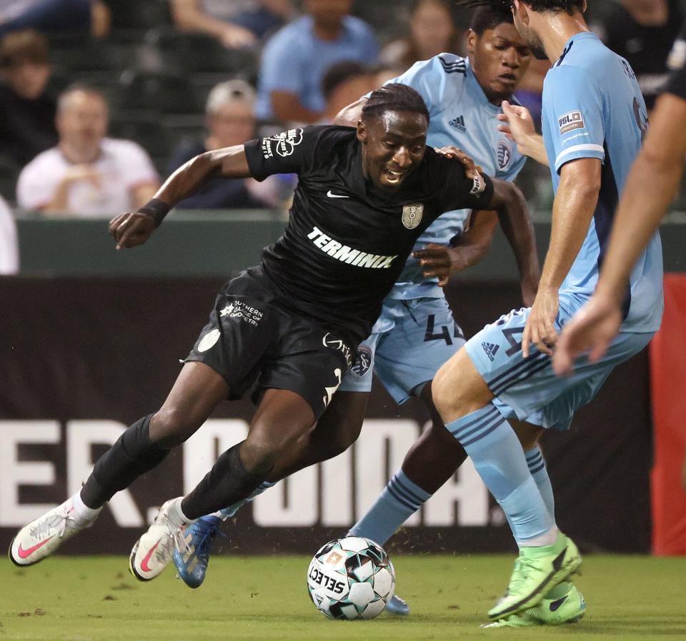 Memphis 901 FC's Mark Segbers drives into the defense of Sporting Kansas City II during their match at AutoZone Park on Wednesday, Oct. 6, 2021.