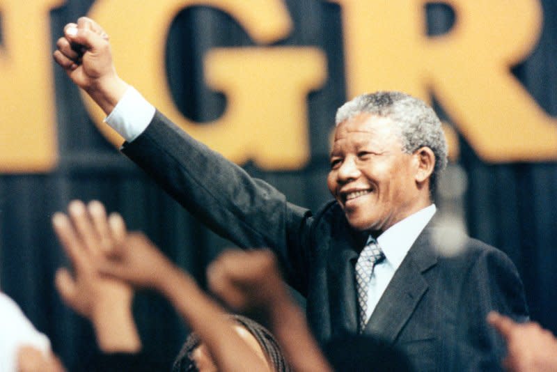 Nelson Mandela raises his fist to the crowd at the Washington Convention Center during his introduction June 26, 1990. On April 26, 1994, South Africans began going to the polls in the country's first election that was open to all. Four days of voting would elect Mandela president. File Photo by Martin Jeong/UPI