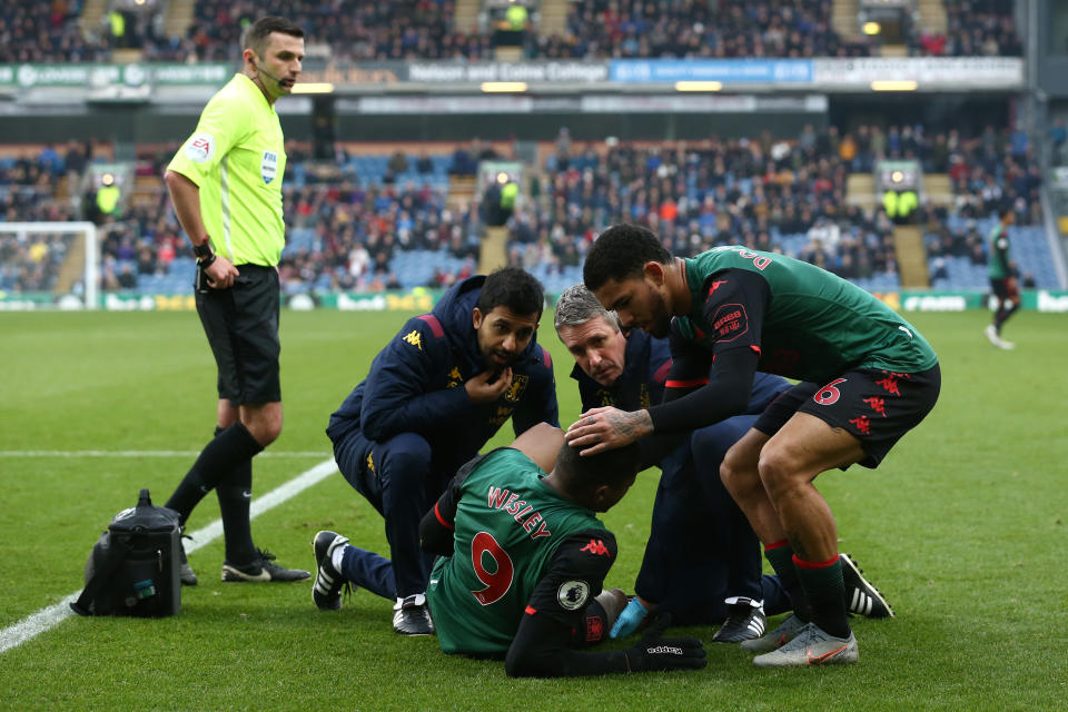 BURNLEY, ENGLAND - JANUARY 01: Wesley of Aston Villa receives medical attention during the Premier League match between Burnley FC and Aston Villa at Turf Moor on January 01, 2020 in Burnley, United Kingdom. (Photo by Jan Kruger/Getty Images)