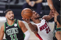 Miami Heat's Jimmy Butler (22) shoots against the Boston Celtics during the first half of an NBA conference final playoff basketball game Friday, Sept. 25, 2020, in Lake Buena Vista, Fla. (AP Photo/Mark J. Terrill)