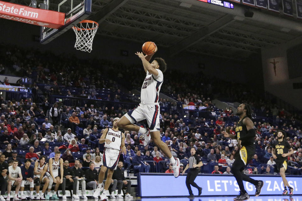 Gonzaga forward Anton Watson (22) goes up for a dunk during the second half of an NCAA college basketball game against Arkansas-Pine Bluff, Tuesday, Dec. 5, 2023, in Spokane, Wash. Gonzaga won 111-71. (AP Photo/Young Kwak)