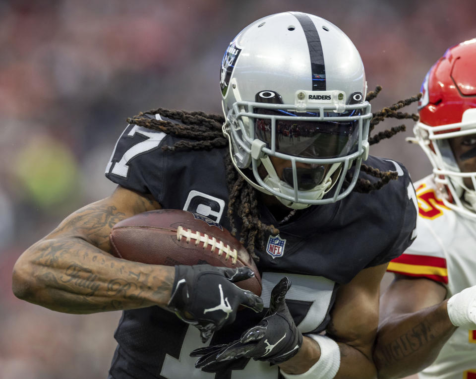 FILE - Las Vegas Raiders wide receiver Davante Adams (17) catches a pass against the Kansas City Chiefs during an NFL football game Jan. 7, 2023, in Las Vegas. Adams didn’t miss a step after leaving Aaron Rodgers and Green Bay and going to Las Vegas. (AP Photo/Jeff Lewis, File)