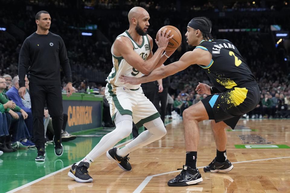 Boston Celtics' Derrick White (9) looks to move against Indiana Pacers' Andrew Nembhard (2) during the first half of an NBA basketball game, Tuesday, Jan. 30, 2024, in Boston. (AP Photo/Michael Dwyer)