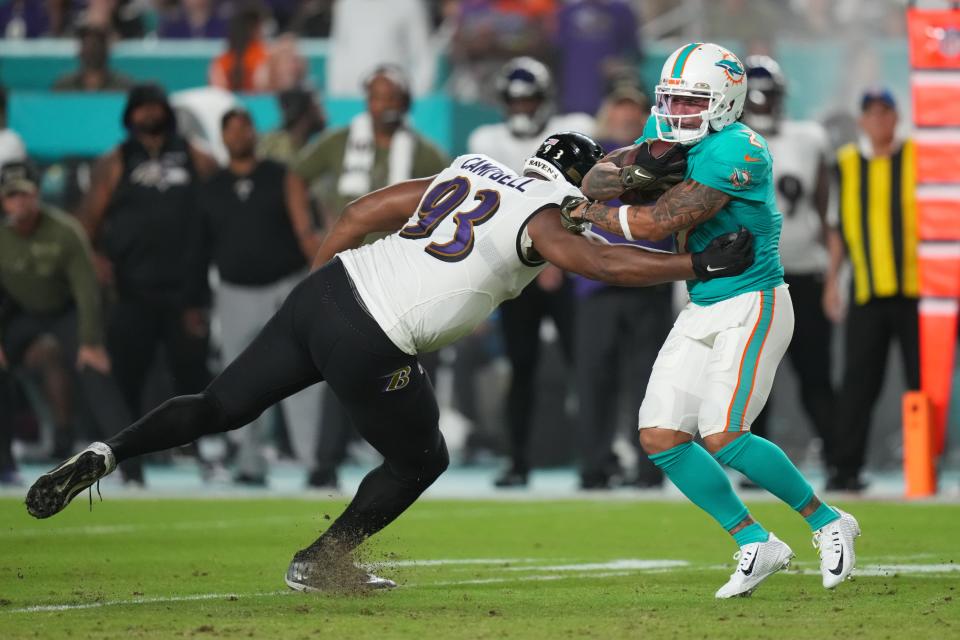 Nov 11, 2021; Miami Gardens, Florida, USA; Miami Dolphins wide receiver Albert Wilson (2) breaks the tackle of Baltimore Ravens defensive end Calais Campbell (93) during the first half at Hard Rock Stadium. Mandatory Credit: Jasen Vinlove-USA TODAY Sports