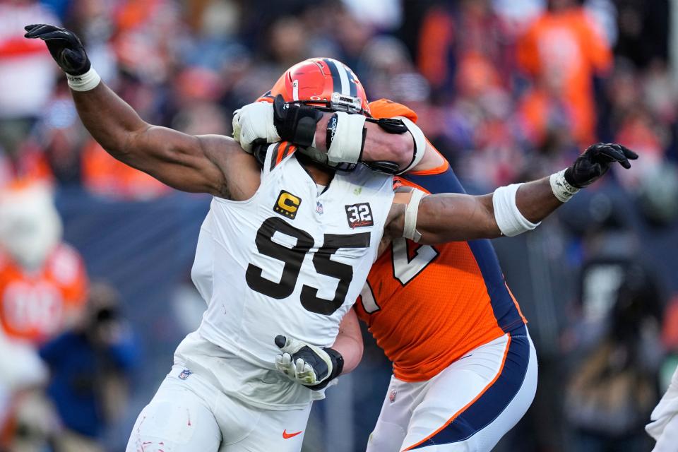 Myles Garrett rushes the passer as Broncos offensive tackle Garett Bolles blocks, Nov. 26, 2023, in Denver.