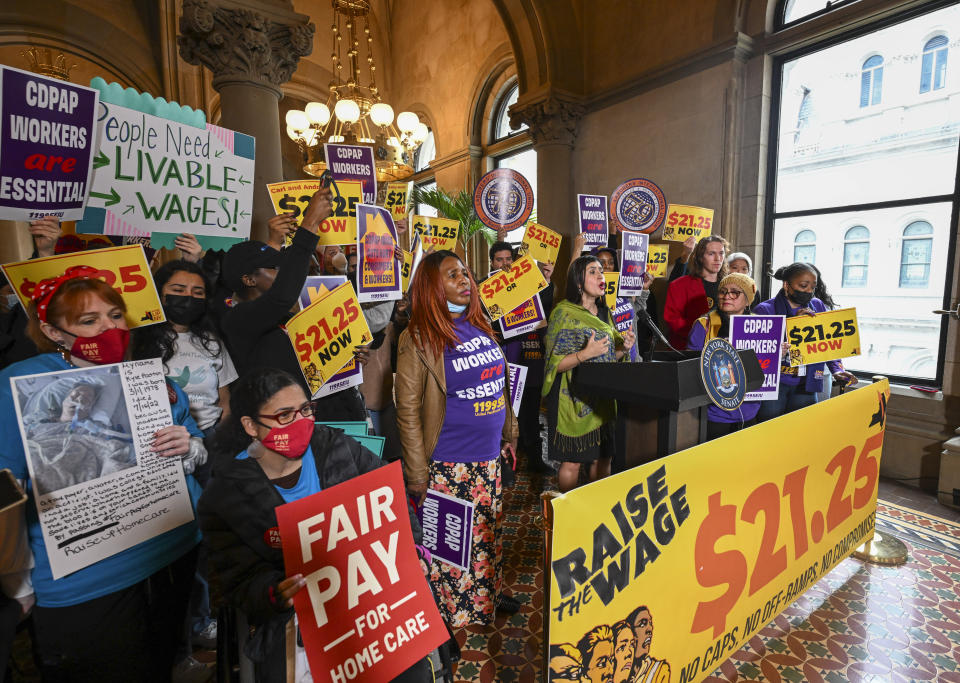 New York Sen. Jessica Ramos, D-East Elmhurst, stands with protesters urging lawmakers to raise New York's minimum wage during a rally at the state Capitol, Monday, March 13, 2023, in Albany, N.Y. (AP Photo/Hans Pennink)