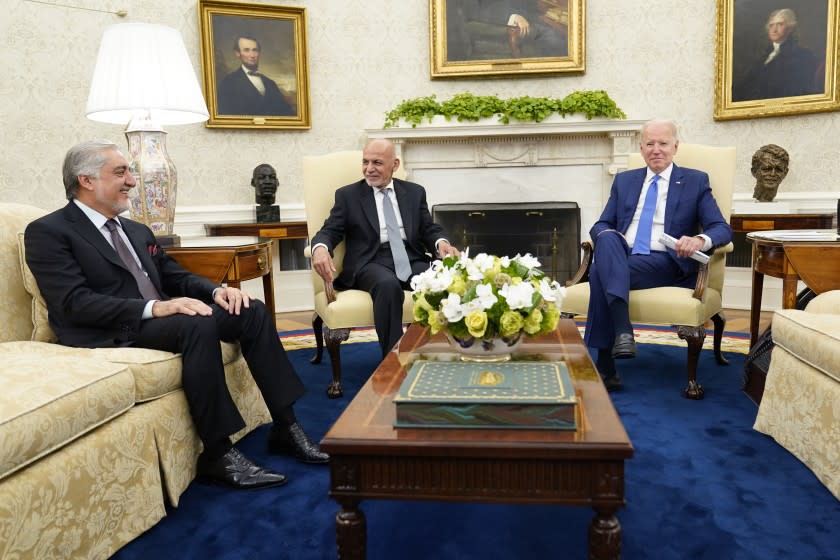 President Joe Biden meets with Afghan President Ashraf Ghani and Chairman of the High Council for National Reconciliation Abdullah Abdullah, left, in the Oval Office of the White House in Washington, Friday, June 25, 2021. (AP Photo/Susan Walsh)