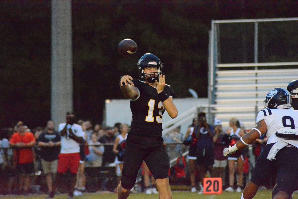 Richmond Hill quarterback Ty Goldrick looks to pass against Effingham County on August 19.