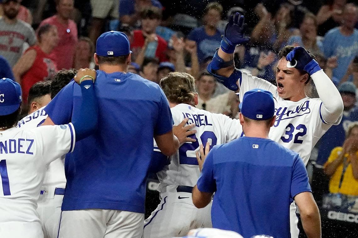 Kansas City Royals’ Nick Pratto (32) celebrates with teammates after hitting a walk-off home run during the ninth inning of a baseball game against the Boston Red Sox Saturday, Aug. 6, 2022, in Kansas City, Mo. The Royals won 5-4. (AP Photo/Charlie Riedel)