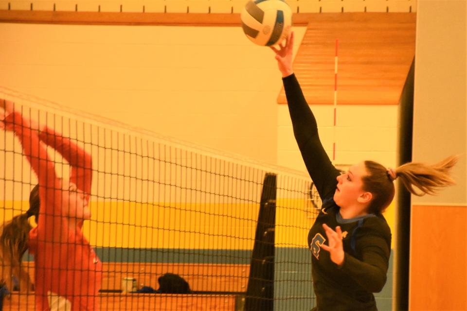 Mt. Markham Mustang Trissa Palmer (right) swats the ball over the net during the second game of Friday's Section III playoff match against South Lewis. The undefeated Mustangs swept three games.