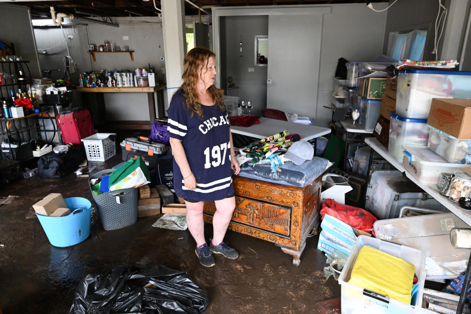 Madeleine Higgs is seen at her flood damaged property in the suburb of Bray Park, Brisbane, yesterday. Heavy rain has lashed an already soaked southeast Queensland. Source: AAP