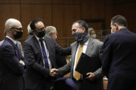 Deputy District Attorney John Lewin, center, is congratulated as attorney Habib A. Balian, right, looks on after New York real estate heir Robert Durst was found guilty Friday, Sept. 17, 2021 in Inglewood, Calif. A Los Angeles jury convicted Robert Durst on Friday of murdering his best friend 20 years ago, a case that took on new life after the New York real estate heir participated in a documentary that connected him to the slaying that was linked to his wife’s 1982 disappearance. (Genaro Molina/Los Angeles Times via AP, Pool)