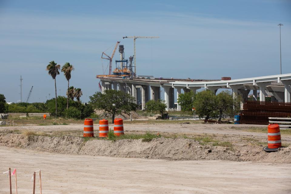 The Harbor Bridge Project is seen behind the site of the former pool at T.C. Ayers Park on Tuesday, July 11, 2023, in Corpus Christi, Texas. 