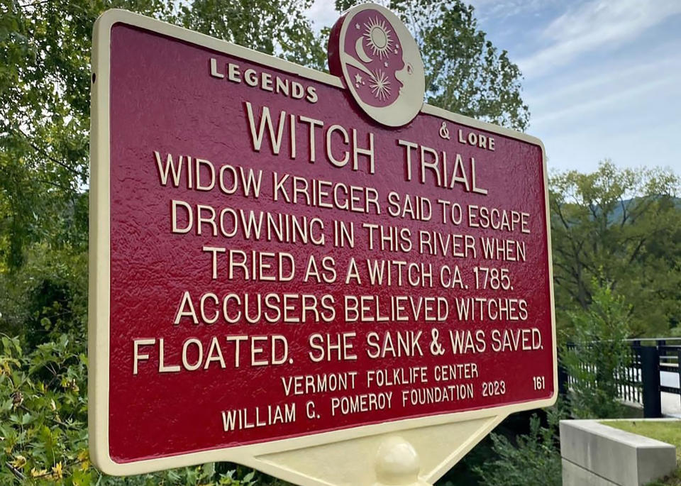 In this Sept. 2023 photo, provided by Alexina Jones, a newly installed marker, in Pownal, Vt., recognizes the survivor of Vermont's only recorded witch trial. Widow Krieger was said to have escaped drowning in the Hoosic River when tried as a witch in 1785, according to the Legends and Lore marker. (Alexina Jones via AP)