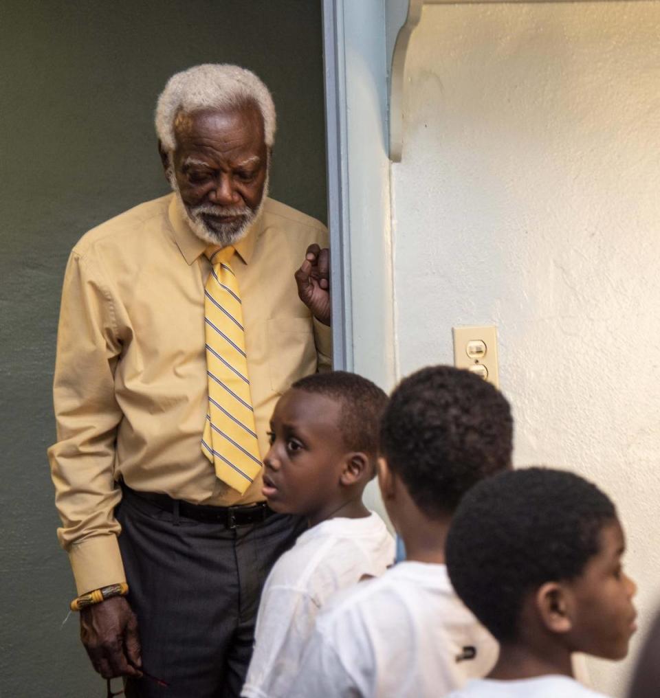 Marshall Davis Sr., director of the African Heritage Cultural Arts Center in Liberty City, helps the 5-year-old class line up for a recorder performance.