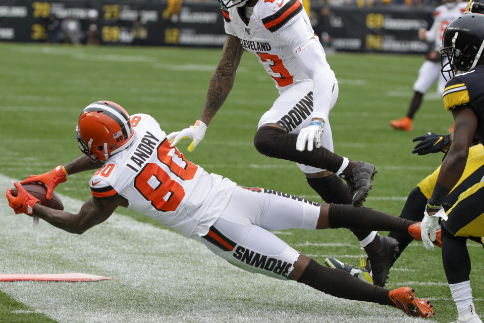 Cleveland Browns wide receiver Jarvis Landry (80) makes a catch in front of Pittsburgh Steelers strong safety Terrell Edmunds (34) in the first half of an NFL football game, Sunday, Dec. 1, 2019, in Pittsburgh. The call was originally called incomplete but was rules a catch on review. (AP Photo/Gene J. Puskar)
