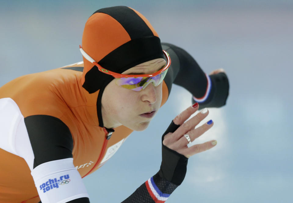 Ireen Wust of the Netherlands, her nails painted in the colors of the Dutch flag, competes in the women's 3,000-meter speedskating race at the Adler Arena Skating Center during the 2014 Winter Olympics, Sunday, Feb. 9, 2014, in Sochi, Russia. (AP Photo/Matt Dunham)