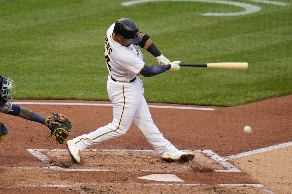 Pittsburgh Pirates' Phillip Evans grounds out, driving in a run during the second inning of the team's baseball game against the Milwaukee Brewers in Pittsburgh, Friday, July 2, 2021. (AP Photo/Gene J. Puskar)