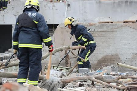 Rescue workers work at the site of a blast in Ningbo, Zhejiang province, China November 26, 2017. REUTERS/Stringer