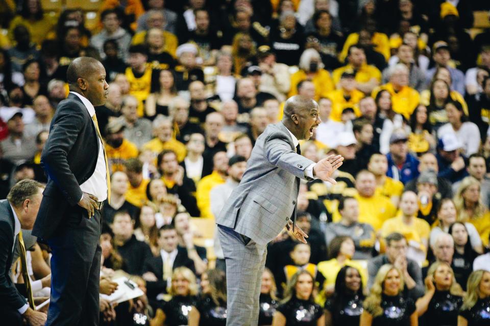 Missouri head coach Dennis Gates (left) and Charlton Young (right) communicate with their players during the Tigers' Border War game against Kansas on Dec. 10, 2022, at Mizzou Arena in Columbia, Mo.