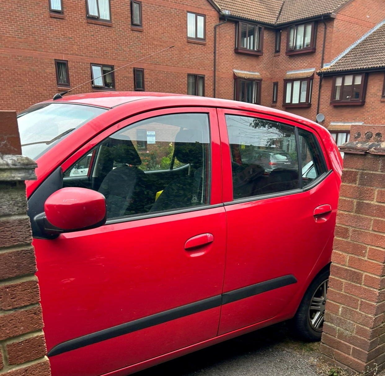 Car blocking an the footpath. Photo released September 5 2024. A disgruntled resident has taken to blocking a footpath with their car in a long-running row over primary school parking.A cul-de-sac in Bushey, Hertfordshire, has been in an ongoing feud with parents who use the private road to park when dropping their kids off at school. The Meadowcroft estate just off the high street is connected by a footpath to St Hildaâ€™s Preparatory School, which makes it an ideal spot for parents to park- to the frustration of residents.Around 18 months ago, ANPR cameras were installed to discourage parents parking and Â£100 penalty charges started appearing in the post.
