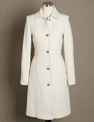 Done in spotless white, a wool coat feels unusually luxurious.