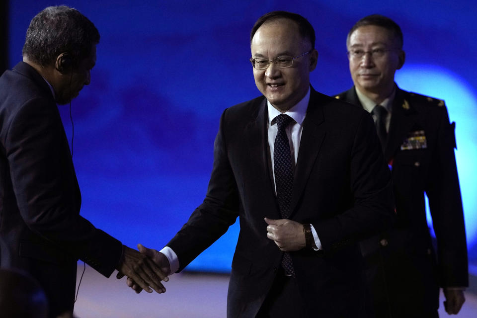 Nong Rong, Assistant Minister of Foreign Affairs of China, center leaves after speaking at the 10th Beijing Xiangshan Forum in Beijing, Tuesday, Oct. 31, 2023. Singapore's Defense Minister Ng Eng Hen called on China, as a dominant power in Asia, to take the lead in reducing tensions by being a benevolent one, warning that military conflict like the wars in Ukraine and Gaza would be devastating to the region's future. (AP Photo/Ng Han Guan)