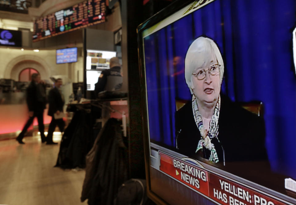 A television screen on the floor of the New York Stock Exchange shows Federal Reserve Chair Janet Yellen's first news conference, in Washington D.C., Wednesday, March 19, 2014. The Federal Reserve is seeking to clarify when it might start to raise short-term interest rates from record lows. The Fed also says it will cut its monthly long-term bond purchases by another $10 billion to $55 billion because it thinks the economy is strong enough to support further improvements in the job market. (AP Photo/Richard Drew)