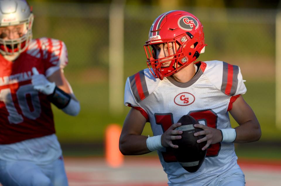 Canton South quarterback Poochie Snyder rolls out for a pass during the second quarter of Friday:s game against Sandy Valley.