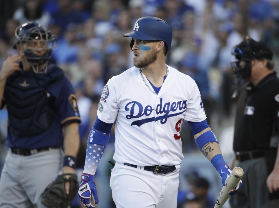 Los Angeles Dodgers' Yasmani Grandal reacts after striking out during the second inning of Game 3 of the National League Championship Series baseball game against the Milwaukee Brewers Monday, Oct. 15, 2018, in Los Angeles. (AP Photo/Jae Hong)