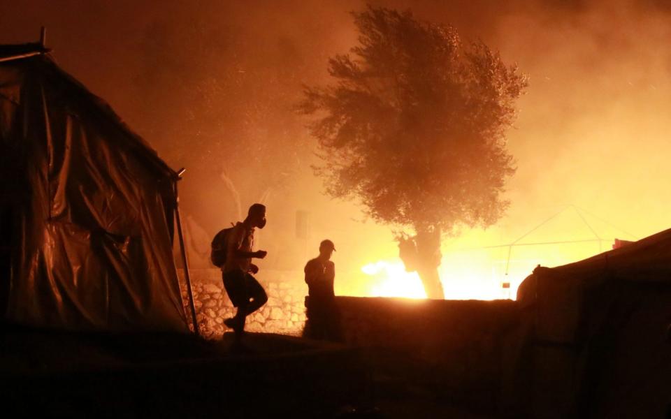 The fire gutted a large part of the camp on the island of Lesbos - AFP