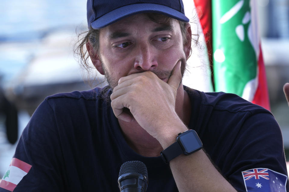 Captain Scott Waters, who drove the small, 3-person underwater craft, a Pisces VI submarine, reacts as he speaks about the dead bodies during a press conference at the Lebanese navy base, in Tripoli, north Lebanon, Friday, Aug. 26, 2022. The Lebanese navy and a submarine crew on Friday announced that they found the remains of at least seven of the approximately 30 drowned migrants in a sunken ship off the coast of Tripoli. (AP Photo/Hussein Malla)