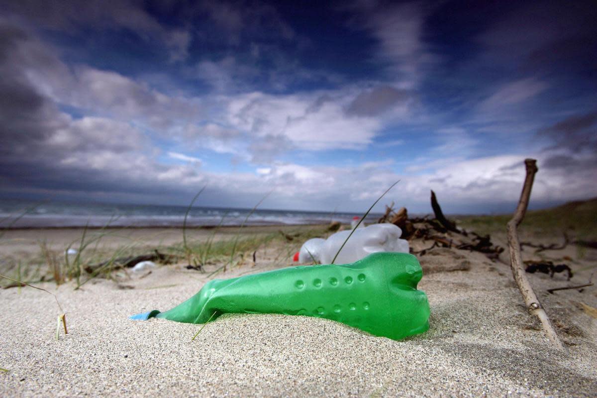 Plastic bottles washed up by the sea litter the beaches in Prestwick, Scotland