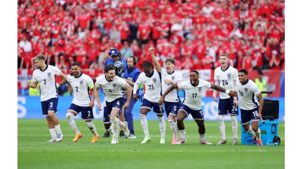 The England team celebrating after winning the penalty shootout 