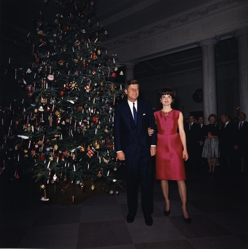 John F and Jacqueline Kennedy at a White House Christmas party in 1962.
