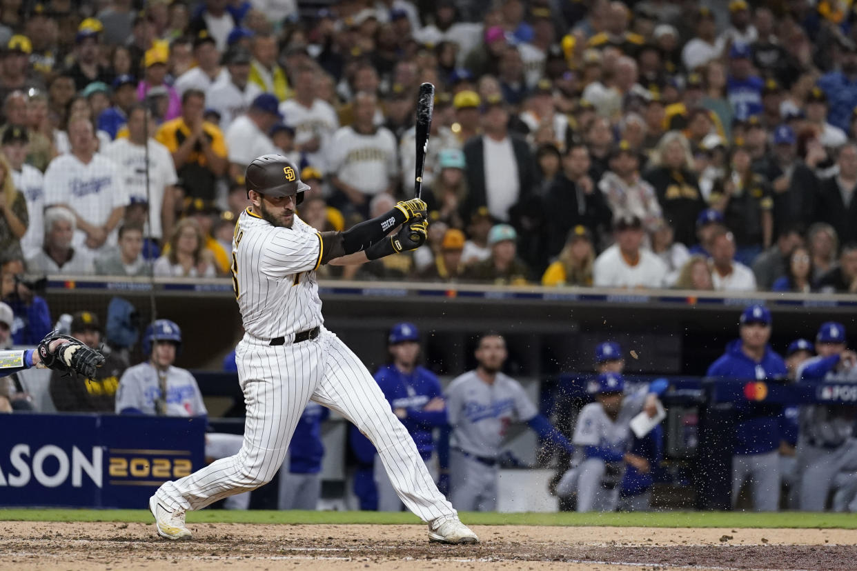 San Diego Padres' Austin Nola watches his RBI single during the seventh inning in Game 4 of a baseball NL Division Series against the Los Angeles Dodgers, Saturday, Oct. 15, 2022, in San Diego. (AP Photo/Ashley Landis)