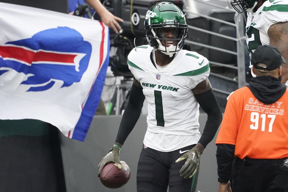 New York Jets cornerback Sauce Gardner (1) celebrates after making an interception during the second half of an NFL football game against the Buffalo Bills, Sunday, Nov. 6, 2022, in East Rutherford, N.J. (AP Photo/John Minchillo)